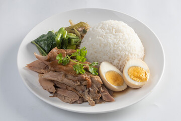 Stewed pork legs with rice isolated on white