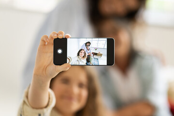 Smiling caucasian teen girl, millennial woman and old grandma make selfie on phone screen, enjoy spare time