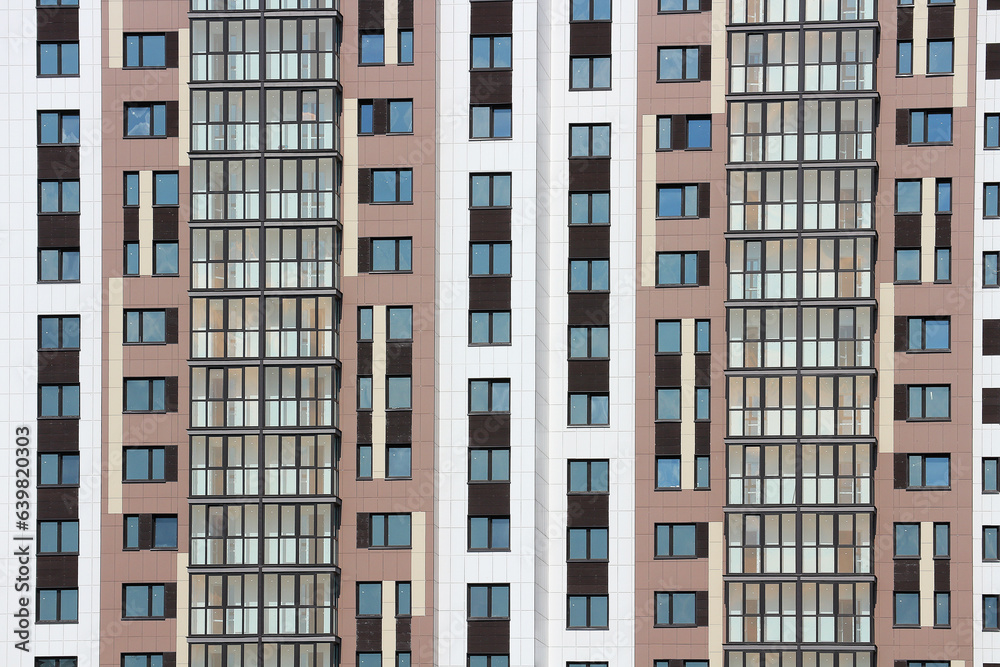 Wall mural windows of a multi-storey residential building. abstract urban background.