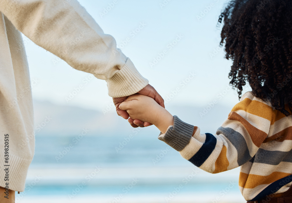 Sticker Family, holding hands and parent with a child on the beach while on summer vacation for travel together from the back. Love, children or nature with a kid and adult looking at the view of the ocean