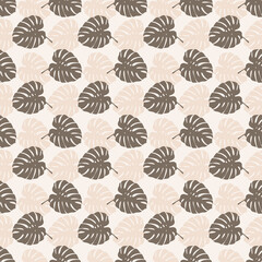 Tropical leaves seamless pattern of Monstera philodendron leaves in beige color tone, tropical background. © Tanita