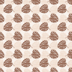 Tropical leaves seamless pattern of Monstera philodendron leaves in beige color tone, tropical background. © Tanita