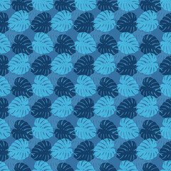 Tropical leaves seamless pattern of Monstera philodendron leaves in blue color tone, tropical background. © Tanita