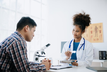 medical doctor holing patient's hands and comforting her.Kind doctor giving real support for patient. In clinic