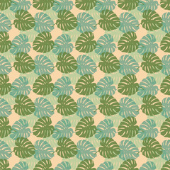 Tropical leaves seamless pattern of Monstera philodendron leaves in green color tone, tropical background. © Tanita