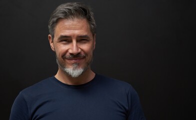 Portrait of mature age, middle age, mid adult man in 50s, happy confident smile. Copyspace.