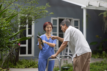 Nurse explaining procedure to patient . Nursing home service and elderly people health care....