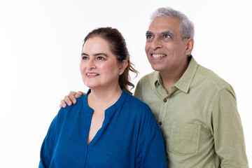 Portrait of loving senior couple over white background