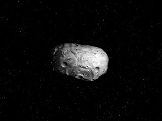 Asteroid in outer space. A celestial object near the Earth's orbit. Space stone on the background of stars.