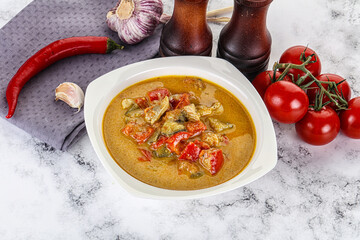 Traditional yellow Thai curry with chicken