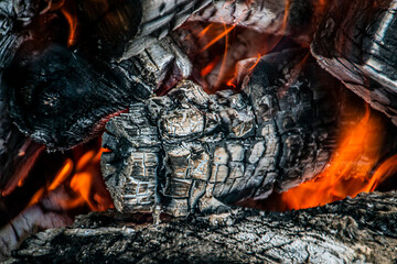 Fire in the brazier with firewood and coals