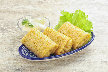 Stuffed pancakes with meat and cream