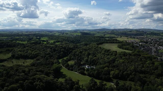 Newton Abbot, South Devon, England: DRONE VIEWS: Bradley Wood; the River Lemon valley and a distant view of Bradley Manor House. The River Lemon runs through the historic market town of Newton Abbot.