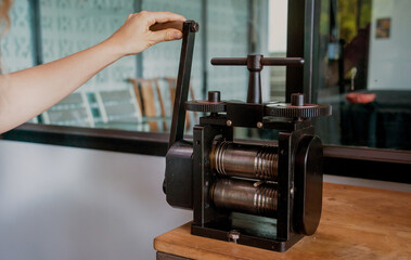 Teacher jeweler and student make jewelry in workshop
