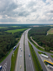 aerial drone view of motorway ad parking with trucks and trailers in Germany 