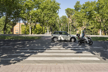 A zebra crossing on a street leading to an urban
