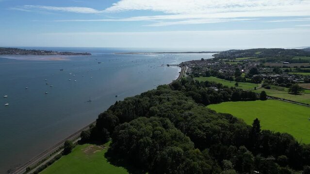 River Exe, South Devon, England: DRONE VIEWS: The River Exe and estuary; Starcross village (right) and the mainline railway line. Starcross ferry links to the popular UK resort of Exmouth (left).