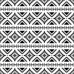 Ethnic motif abstract geometric background design. Tribal art seamless stripe pattern in Aztec style. Design for textile template and print fabric. Black and white color.