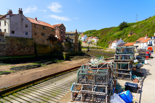 Crab and lobster pots on the quayside in Staithes harbour.