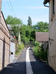 Fototapeta na wymiar In the street of Lyons-la-Forêt village. June 15th, 2023, France.