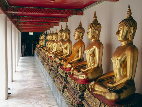 Golden Buddha statues inside a Buddhist temple