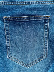 closeup back pocket of jeans denim blue color