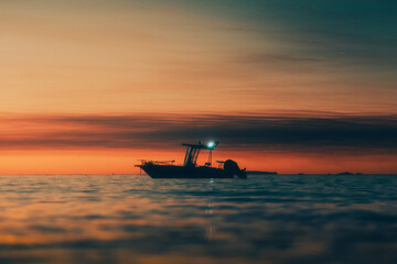 Fototapeta premium Small Boat During Sunset