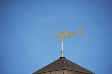 Shark weather vane on the roof of an oceanarium in Denmark