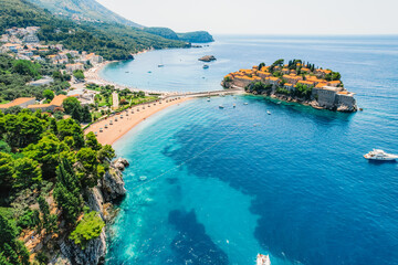 Beautiful beach and Sveti Stefan island near Budva, Montenegro. Luxury resort at Adriatic sea. - obrazy, fototapety, plakaty