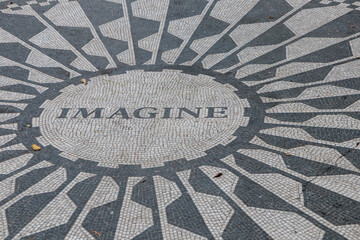 The caption "Imagine" on the Strawberry Fields John Lennon memorial mosaic, Central Park, New York, USA