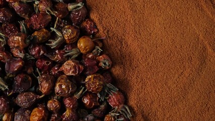 Dry rosehip fruits and rosehip powder for brewing tea or vitamin tinctures for immunity. Dog rose or briar uses in alternative medicine. Natural antioxidant, contains Vitamin C.