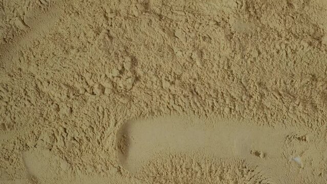 Maca gelatinized flour or Maca powder, close-up. Peruvian superfood, natural organic supplement.