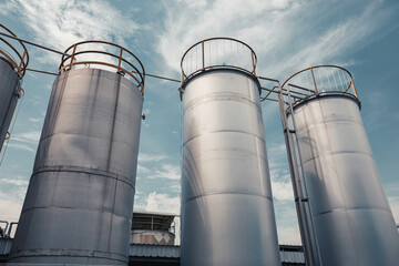 Stainless vertical chemical row tanks with pressure meter in equipment tank chemical cellar at with stainless steel
