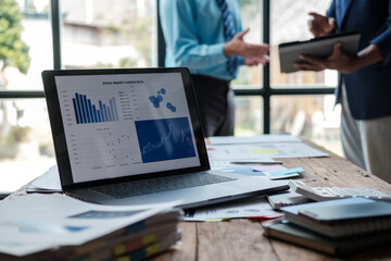 Asian business advisor meeting to analyze and discuss the situation on the financial report in the meeting room.Investment Consultant.