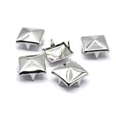 Fototapeta premium Accessories for clothing. Rivet in the form of a pyramid. A stylish app for stage wear.