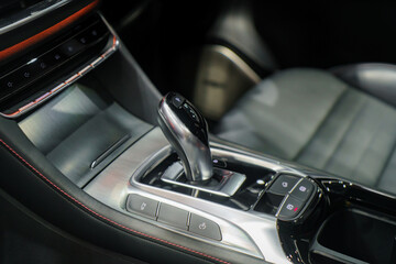 Close up of Modern car automatic gearbox and control buttons in EV car