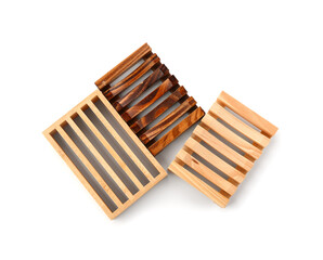 Set of wooden soap dishes isolated on white background
