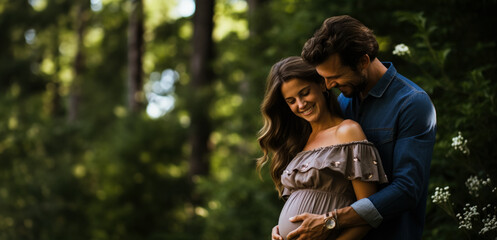 Pregnant couple together in joy and love with hands on her belly 