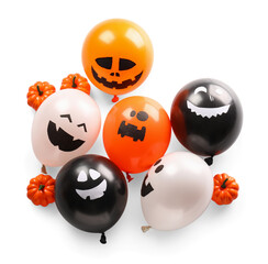 Funny Halloween balloons with pumpkins on white background
