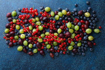 Summer organic berries on blue background