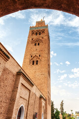 Fototapeta na wymiar Koutoubia Mosque Tower in Marrakech at sunset, Morocco, blue sky background