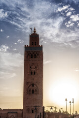 Fototapeta premium Koutoubia Mosque Tower in Marrakech at sunset, Morocco, blue sky background