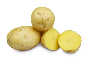 Several fresh yellow whole potatoes and one cut in half isolated on transparent background.