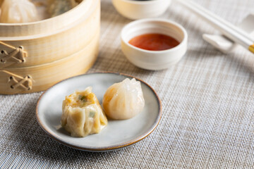 Dim sum steamed in a bamboo basket.