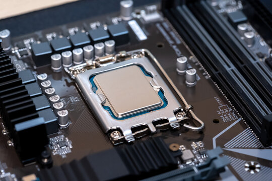 Modern CPU processor installed on a brand new motherboard, object detail, extreme closeup, nobody. Simple generic powerful high end gaming CPU up close, desktop PC up close, parts, components upgrade
