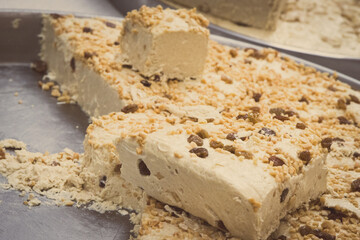 Halva with nuts on stall at bazaar. High calorie snack