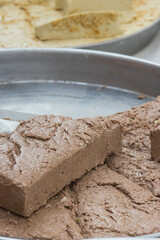 Halva with cocoa on stall at bazaar. High calorie snack