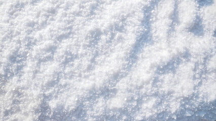 Obraz premium Fresh white snow texture top view. Perfection shining pure snowy background.