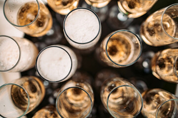 Top view of full champagne glasses. Celebration concept