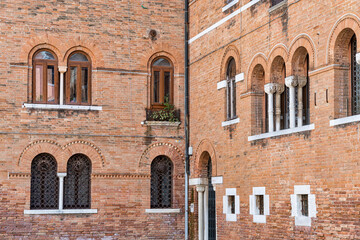 Close up detail with old medieval architecture venetian window.